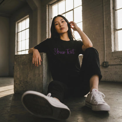 Model wearing custom embroidery t-shirt with violet 3D puff script detail