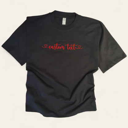 Black t-shirt with custom CUSTOM TEXT embroidery in red thread — Embroidist made to order
