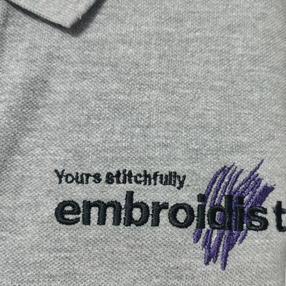 close-up of Embroidist brand embroidery on grey t-shirt