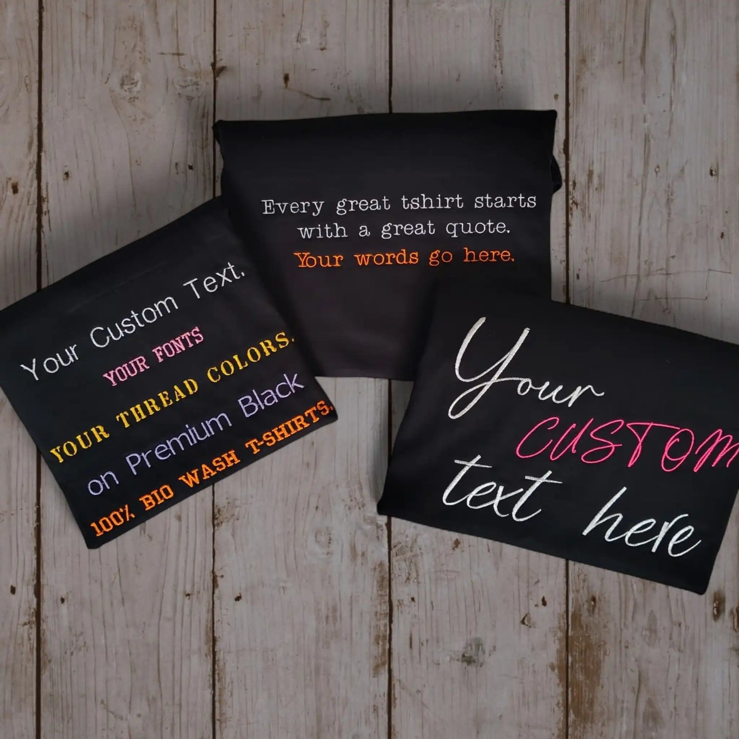 Custom embroidered black t-shirts showing font colours and text placement — your custom text on premium black tee by Embroidist