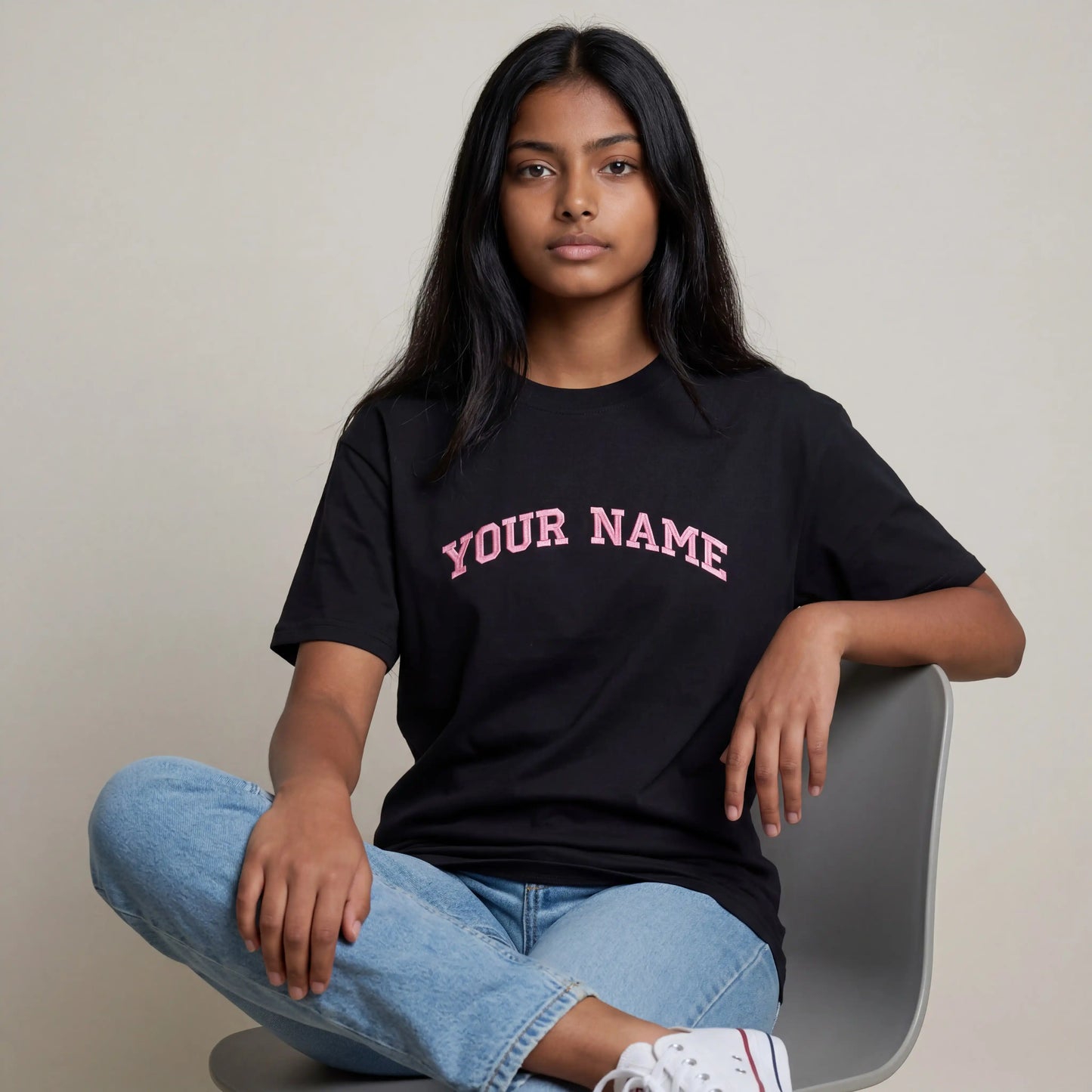 Woman wearing custom embroidered black oversized t-shirt — Embroidist personalised tee