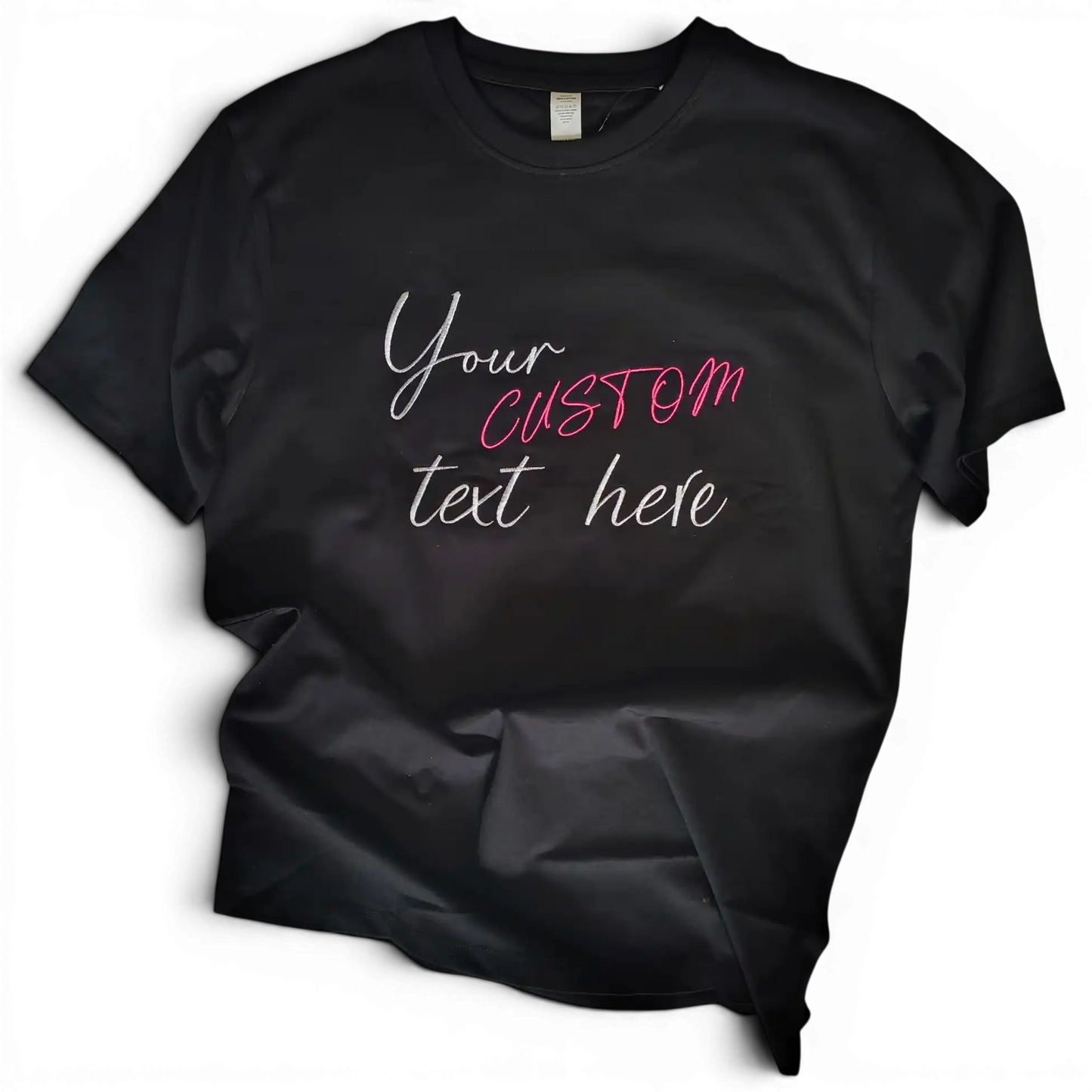 Black t-shirt with custom embroidered text in mixed fonts and colours — made to order by Embroidist