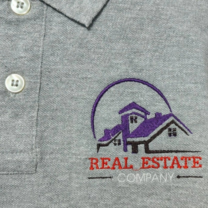 Custom real estate company logo embroidered on grey polo shirt