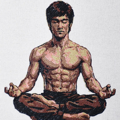 Close up of Bruce Lee thread embroidery portrait detail — iconic wall art by Embroidist
