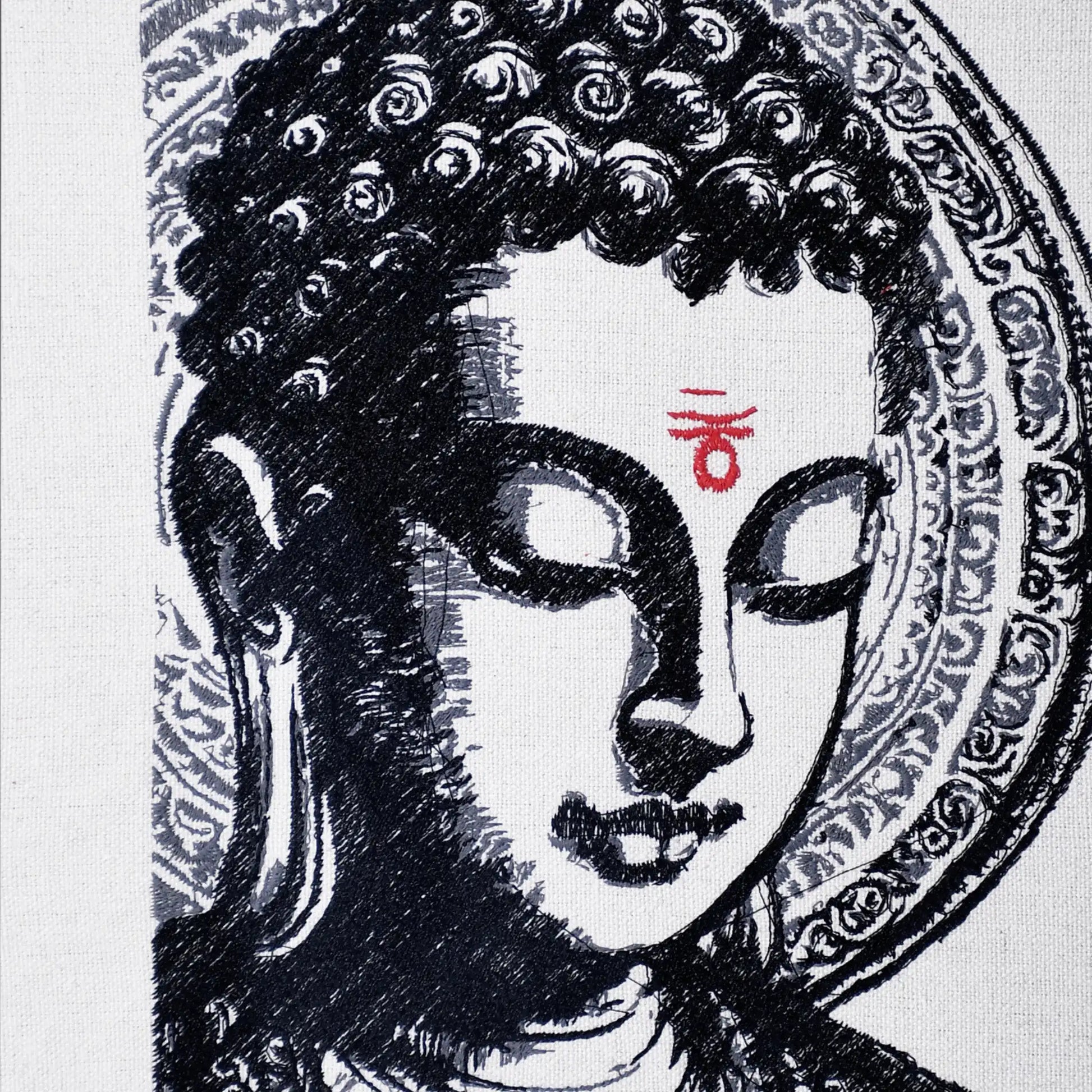 Close up of Buddha thread embroidery detail — spiritual wall art by Embroidist