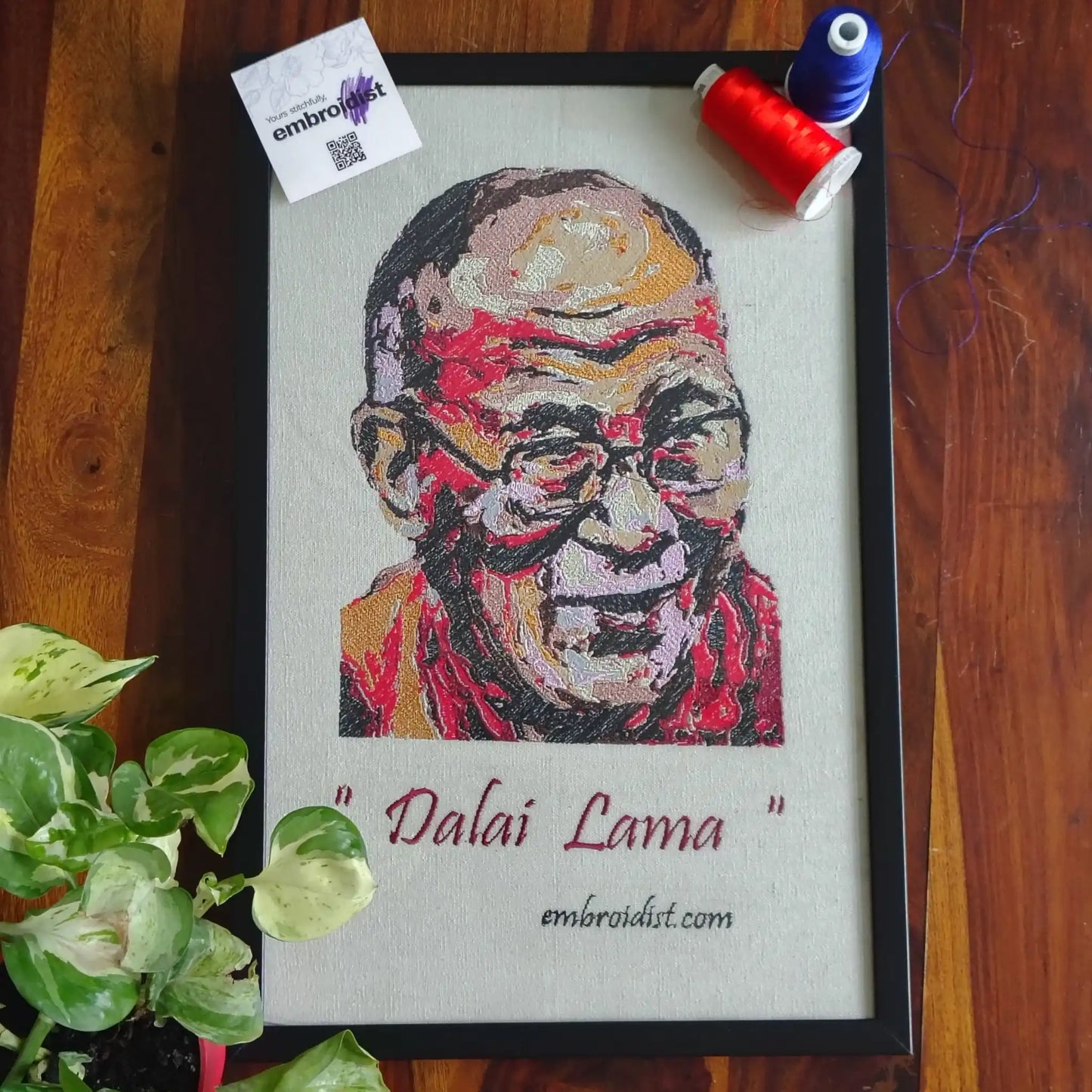 Dalai Lama embroidered wall art lifestyle image — framed art in home setting by Embroidist