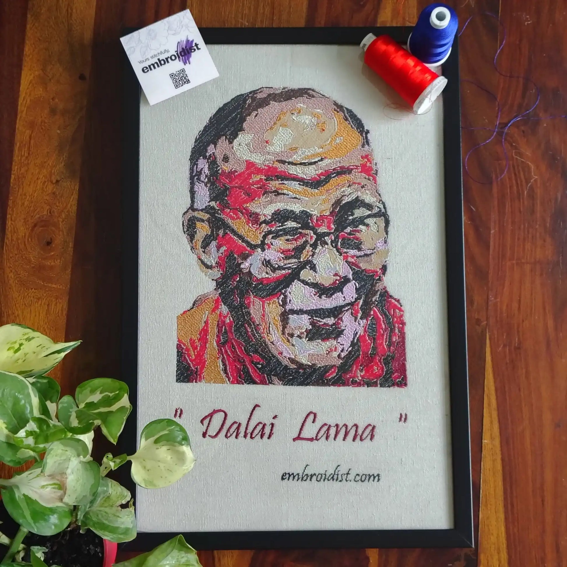 Dalai Lama embroidered wall art lifestyle image — framed art in home setting by Embroidist