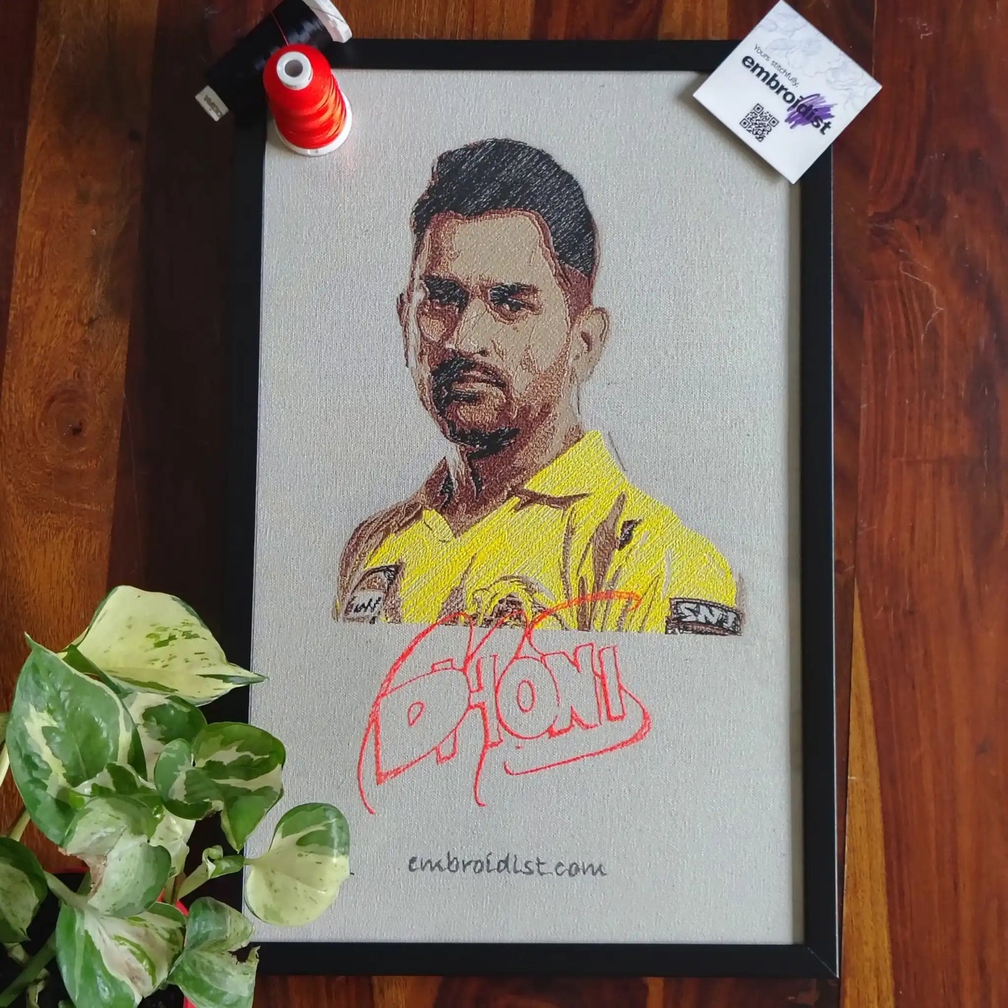 MS Dhoni embroidered wall art lifestyle image — framed art in home setting by Embroidist