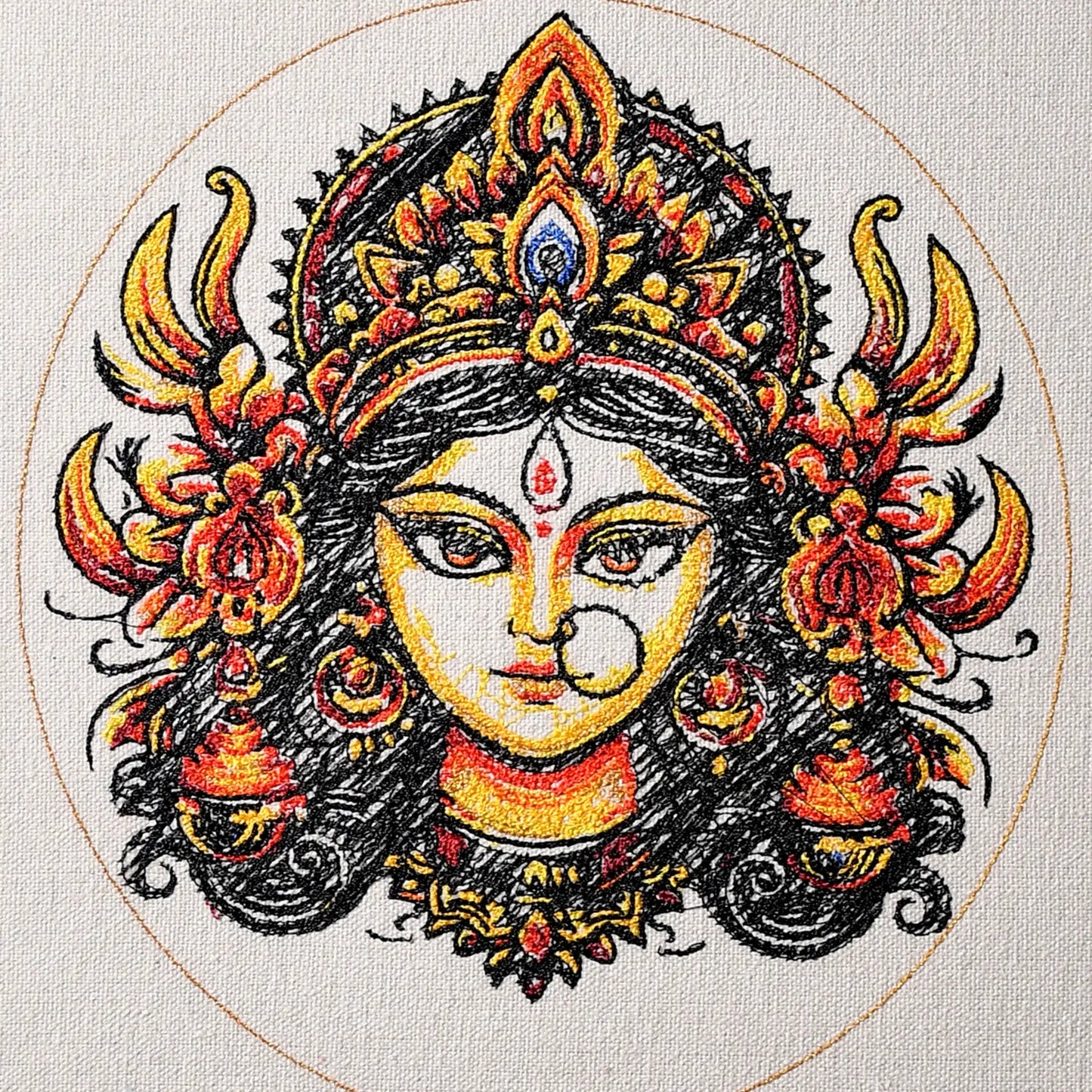 Close up of Durga Maa thread embroidery detail — spiritual wall art by Embroidist