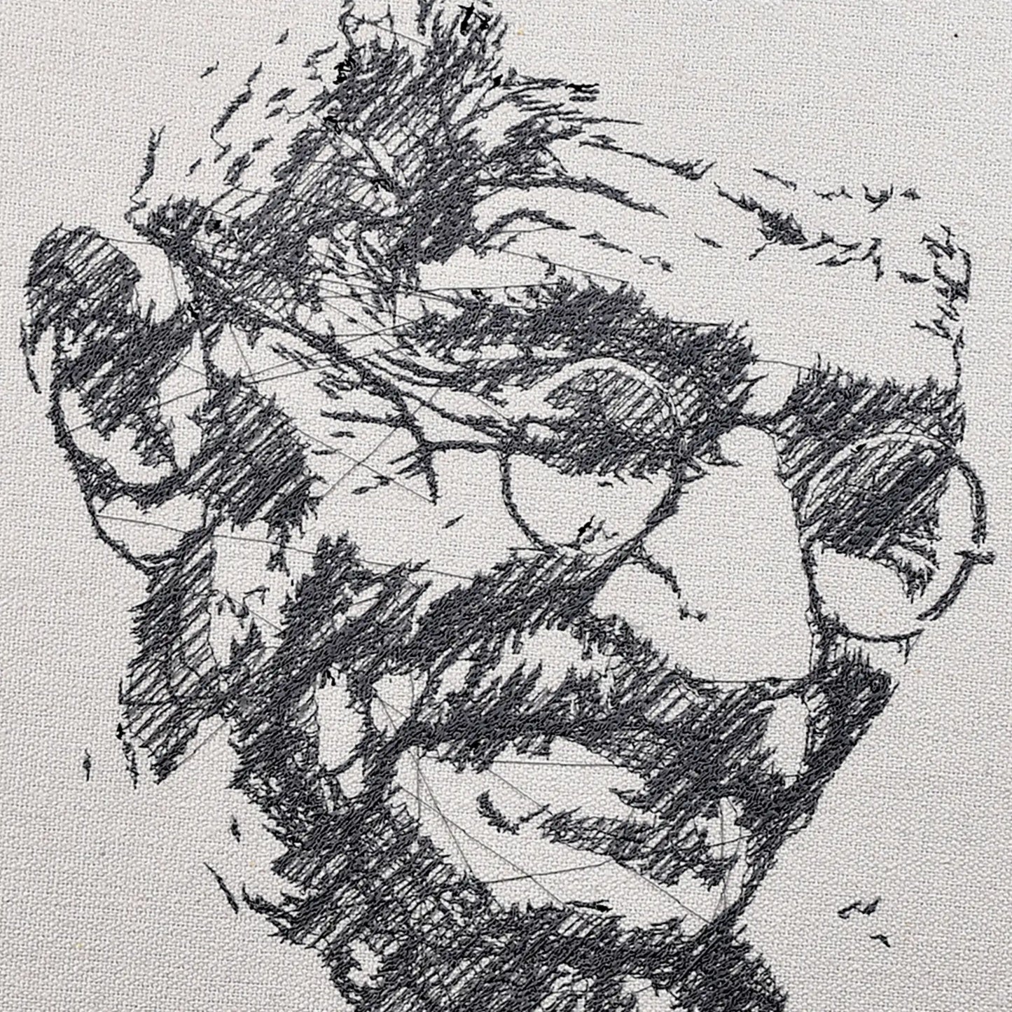 Close up of Mahatma Gandhi thread embroidery portrait detail — historical wall art by Embroidist