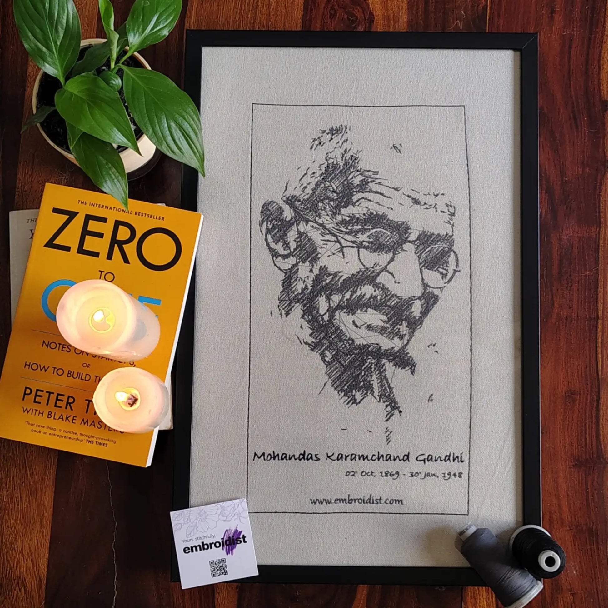 Mahatma Gandhi embroidered wall art lifestyle image — framed art in home setting by Embroidist