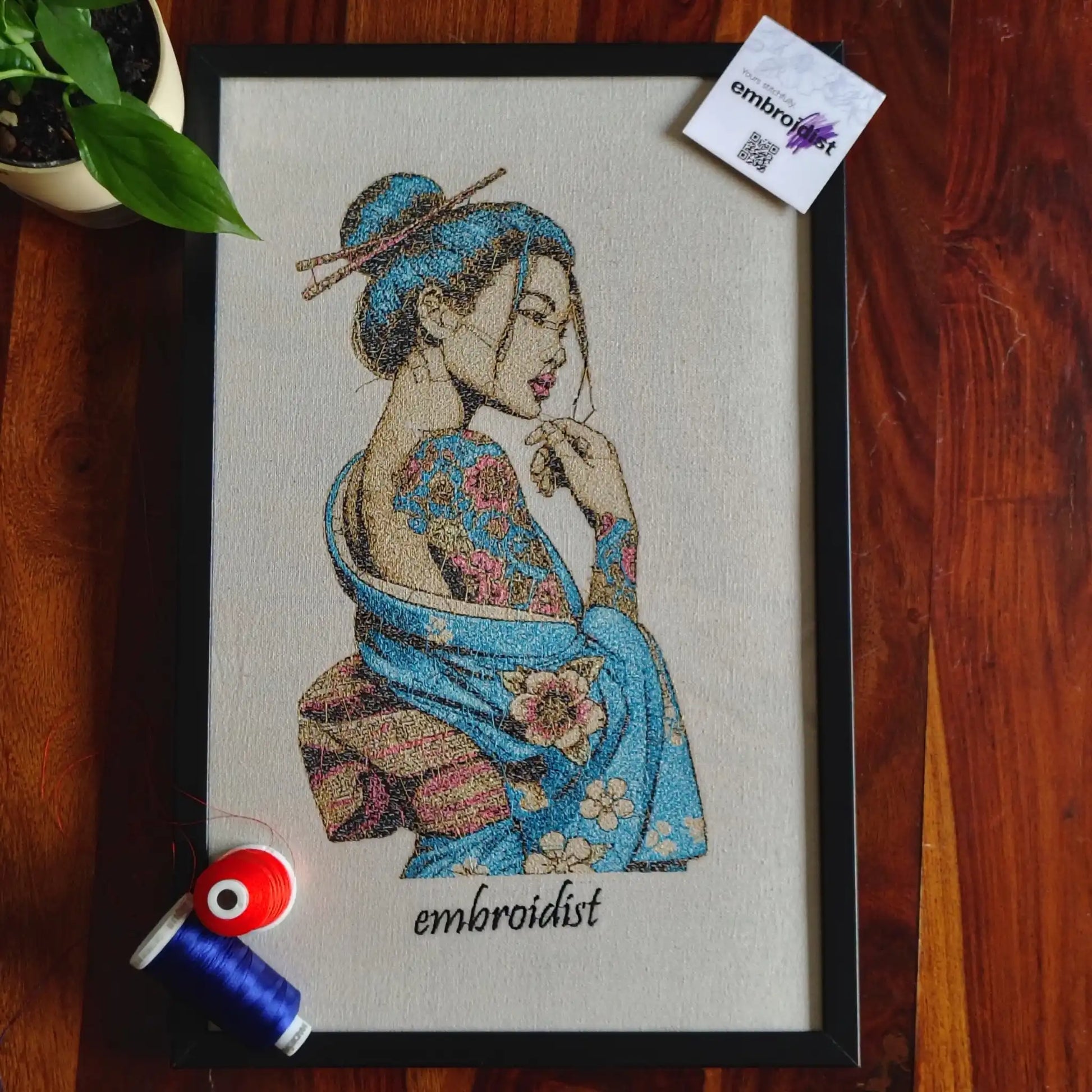 Geisha embroidered wall art lifestyle image — framed art in home setting by Embroidist