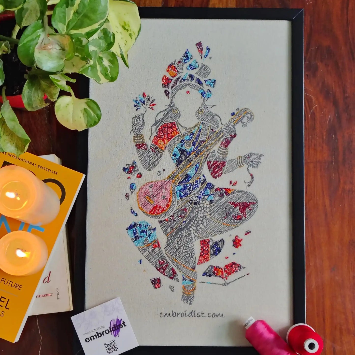 Maa Saraswati embroidered wall art lifestyle image — framed art in home setting by Embroidist