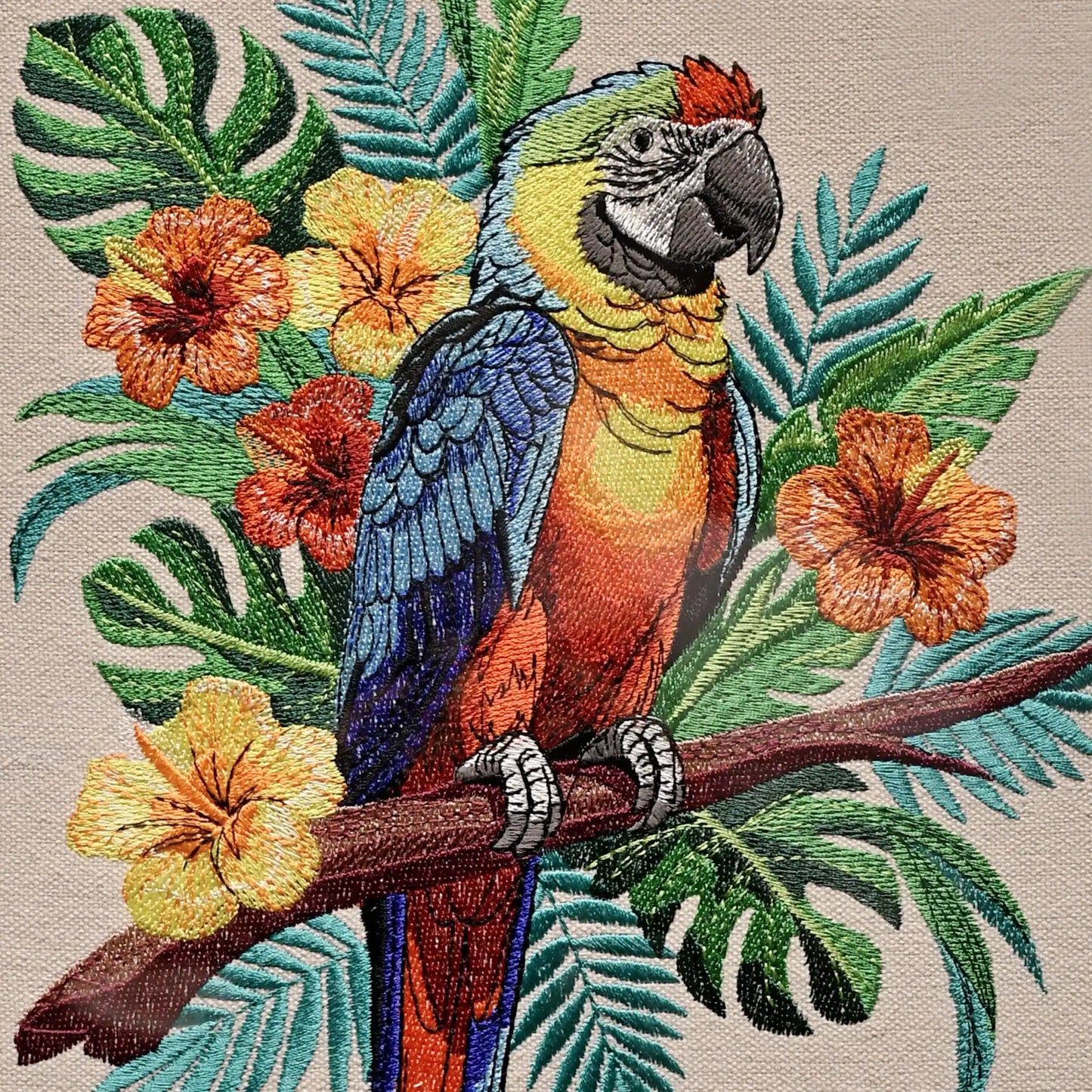 Close up of colourful thread embroidery detail — macaw parrot wall art by Embroidist