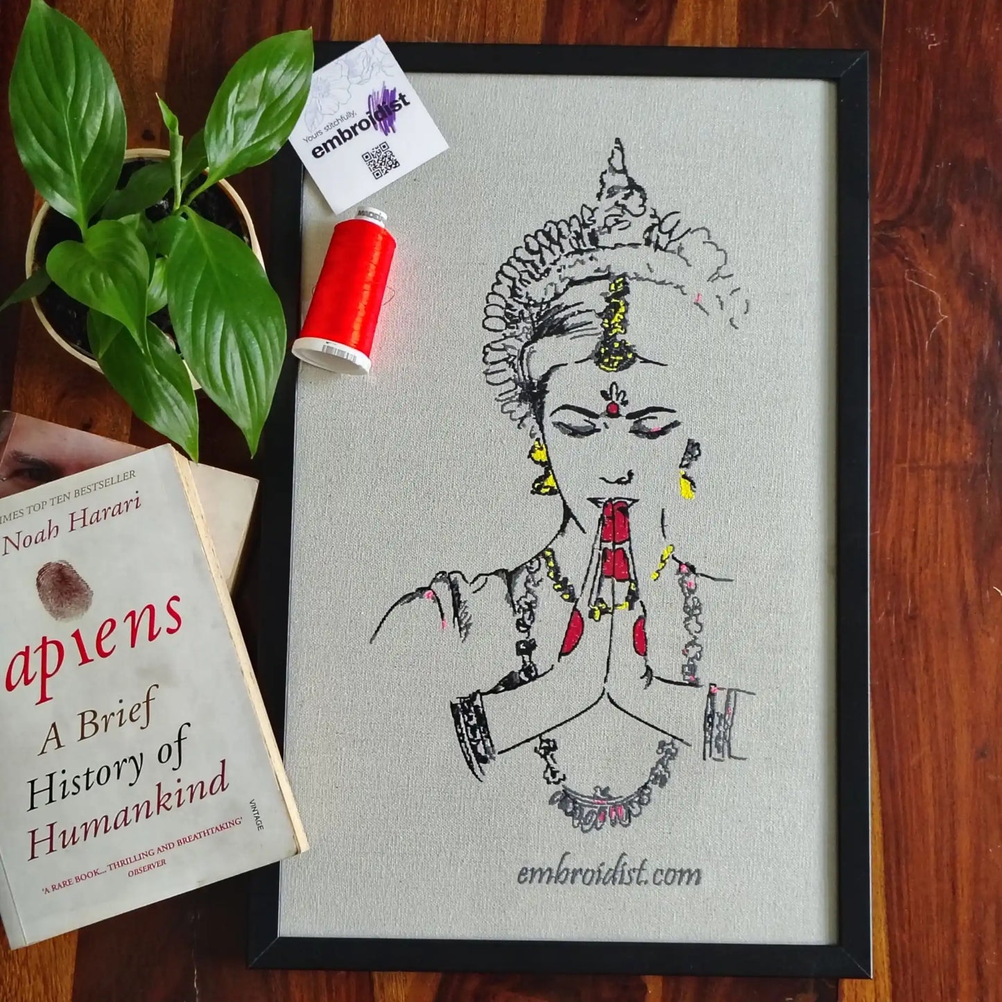 Namaste classical embroidered wall art lifestyle image — framed art in home setting by Embroidist