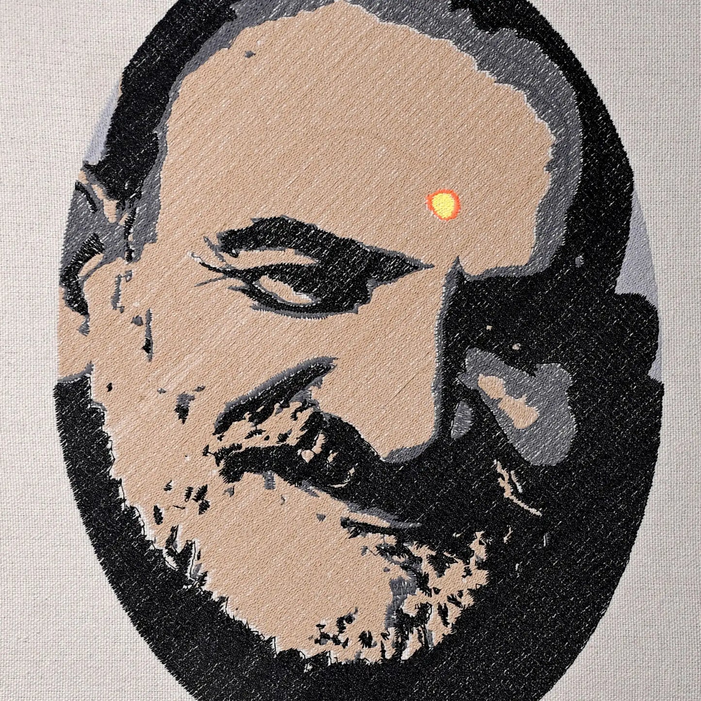 Close up of Neem Karoli Baba thread embroidery portrait detail — spiritual wall art by Embroidist