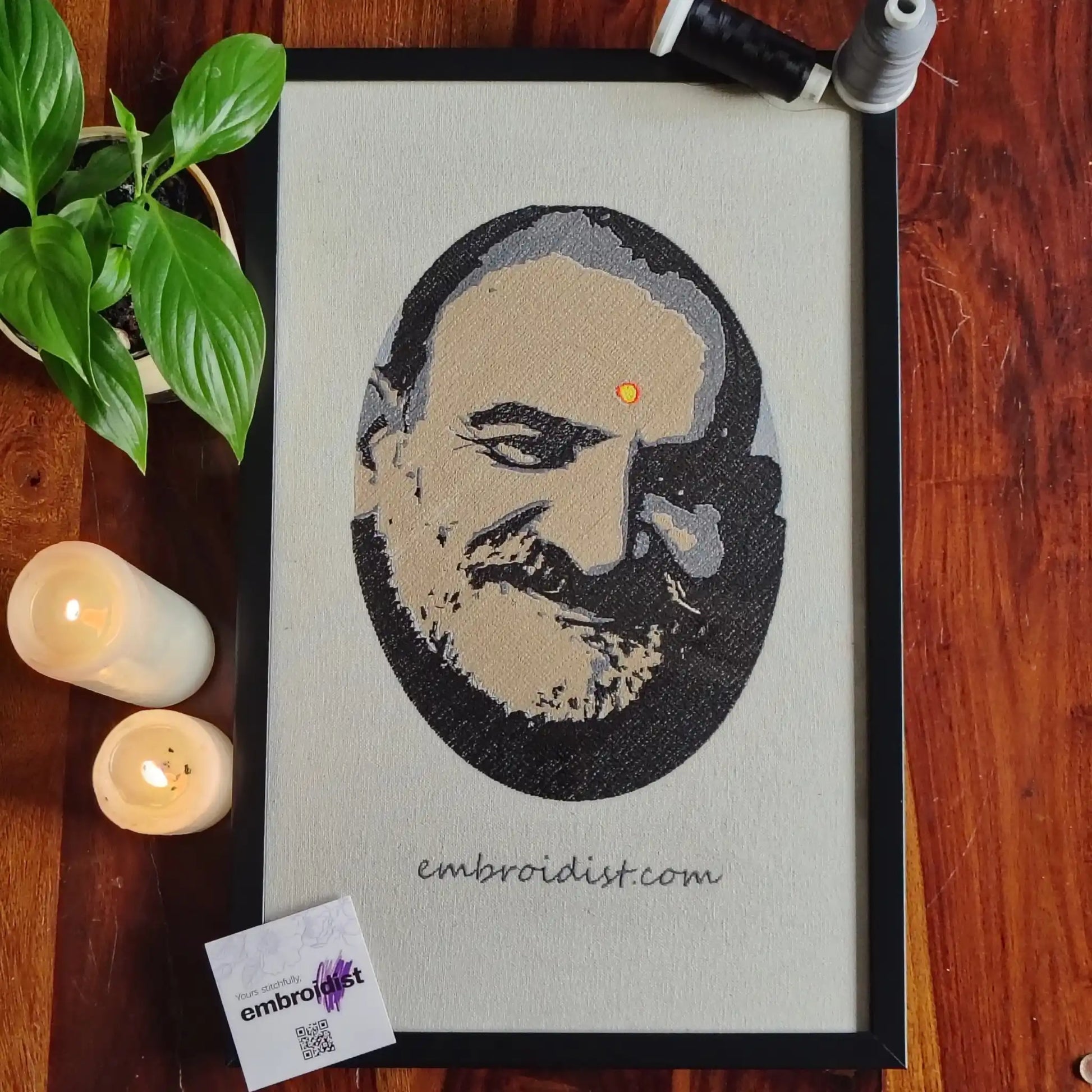 Neem Karoli Baba embroidered wall art lifestyle image — framed art in home setting by Embroidist
