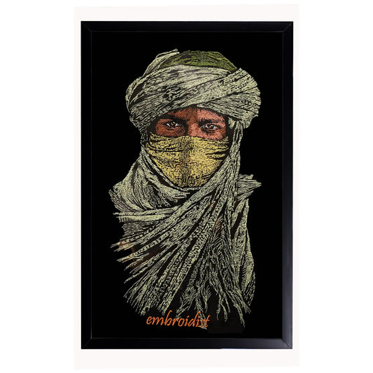 Machine embroidered Nomad wall art — 60,390 stitches on black canvas by Embroidist