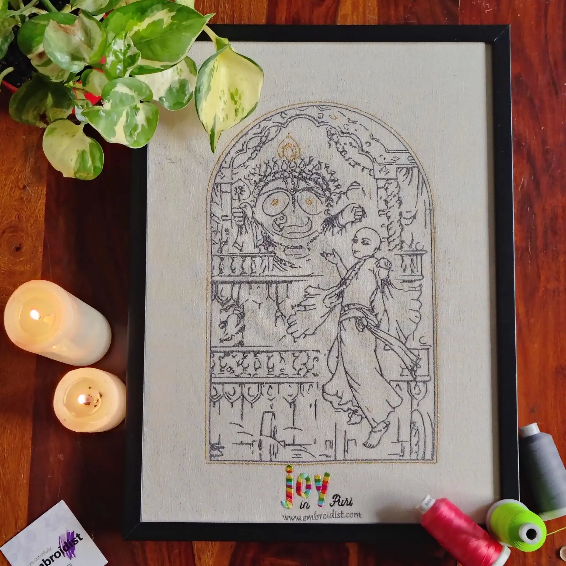 Joy in Puri Jagannathji embroidered wall art lifestyle image — framed art in home setting by Embroidist