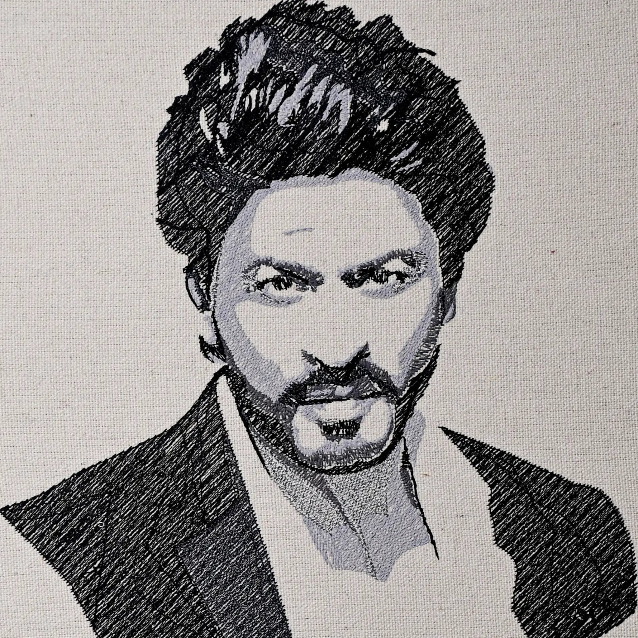 Close up of Shah Rukh Khan thread embroidery portrait detail — Bollywood wall art by Embroidist