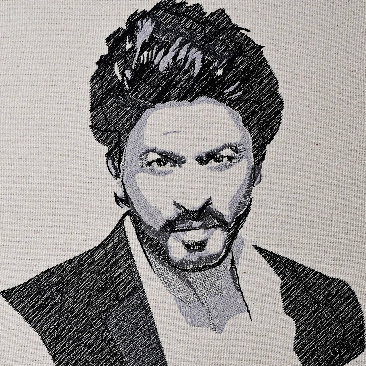 Close up of Shah Rukh Khan thread embroidery portrait detail — Bollywood wall art by Embroidist