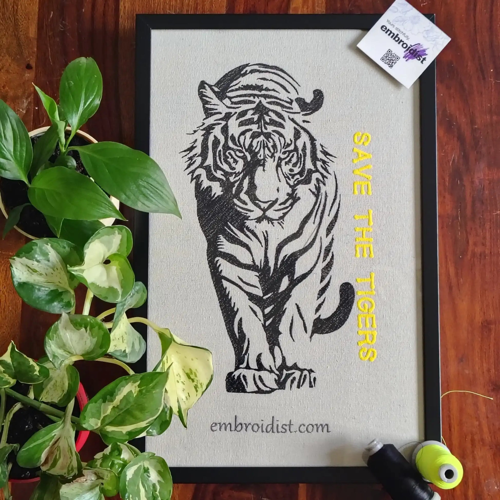 Save The Tigers embroidered wall art lifestyle image — framed art in home setting by Embroidist