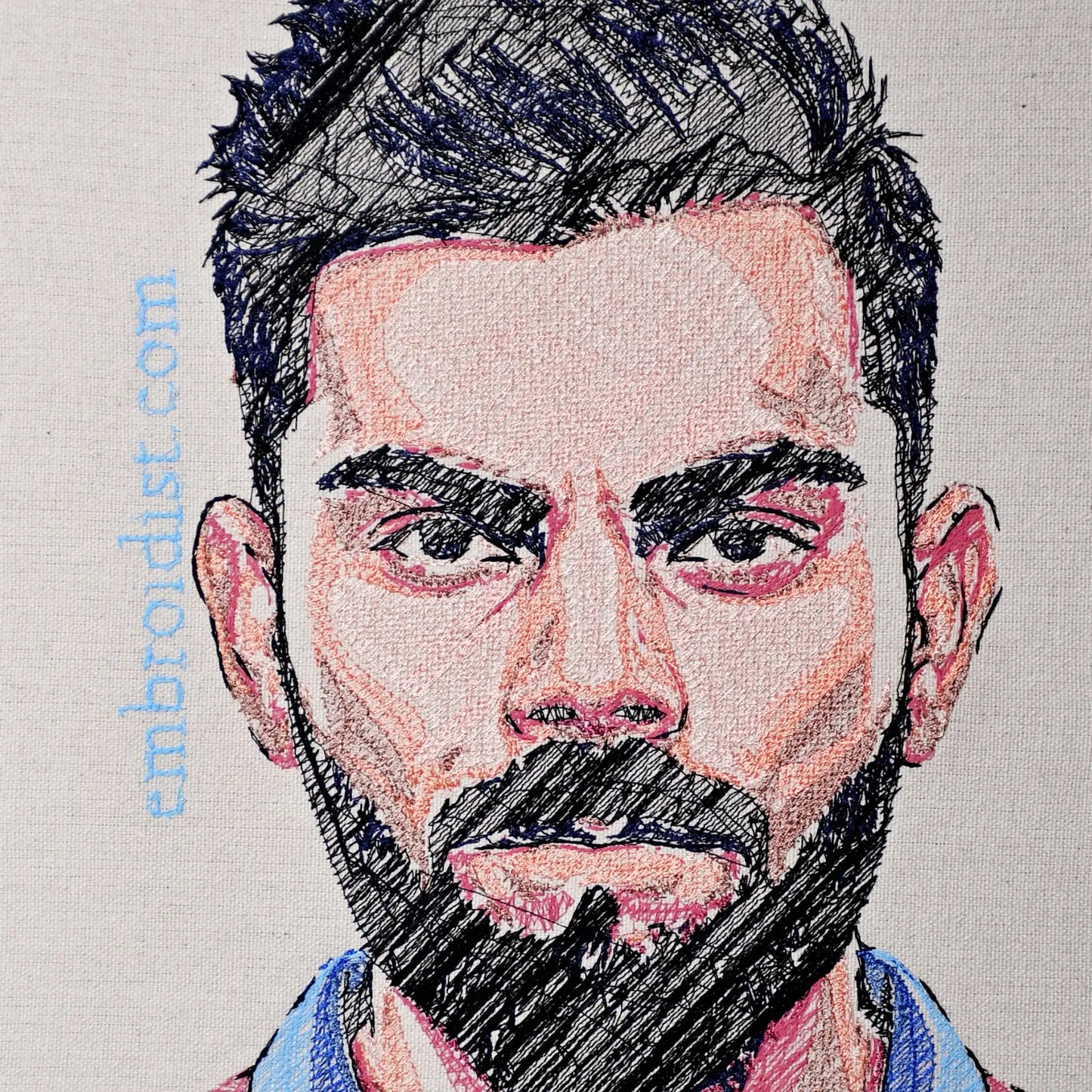 Close up of Virat Kohli thread embroidery portrait detail — cricket wall art by Embroidist