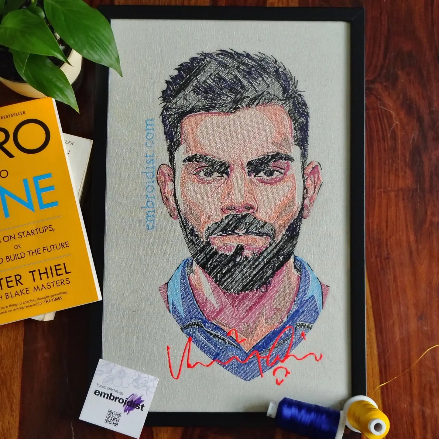 Virat Kohli embroidered wall art lifestyle image — framed art in home setting by Embroidist