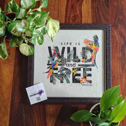 Life Is Wild And Free embroidered wall art lifestyle image — framed art in home setting by Embroidist