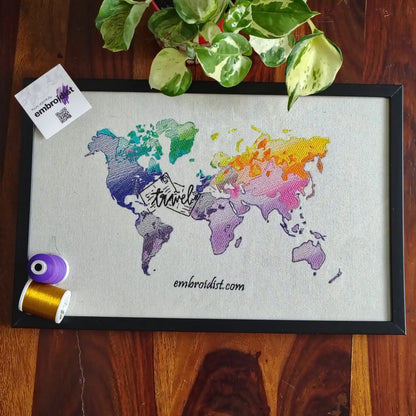 Travel world map embroidered wall art lifestyle image — framed art in home setting by Embroidist