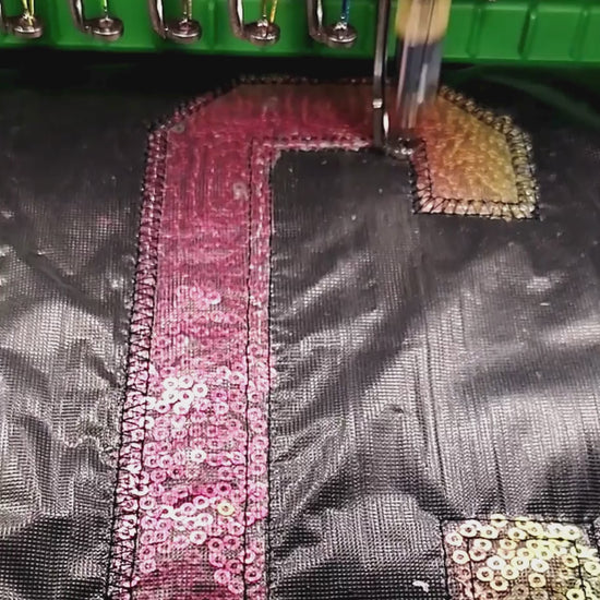 Brother PR-1055X stitching sequin appliqué alphabet letter in-studio — custom embroidery made to order by Embroidist