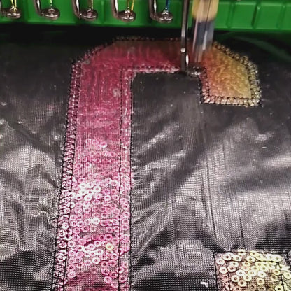 Brother PR-1055X stitching sequin appliqué alphabet letter in-studio — custom embroidery made to order by Embroidist