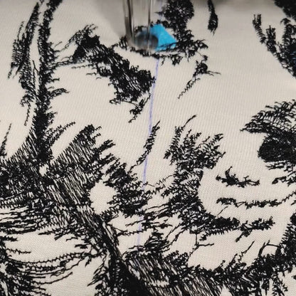 Texture close-up video of machine embroidered Labrador portrait on bio-washed cotton tee — Embroidist