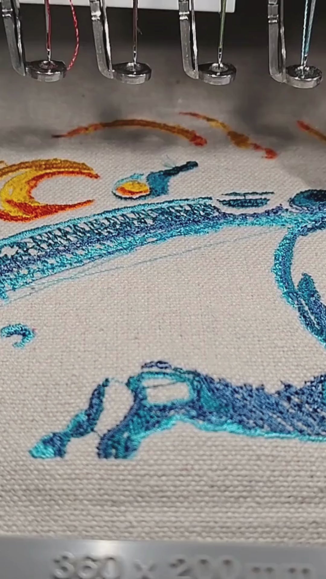 Lord Krishna half face with peacock feather crown and lotus flower in multicolour thread, 50,472 stitches, framed embroidered wall art handcrafted in India by Embroidist
