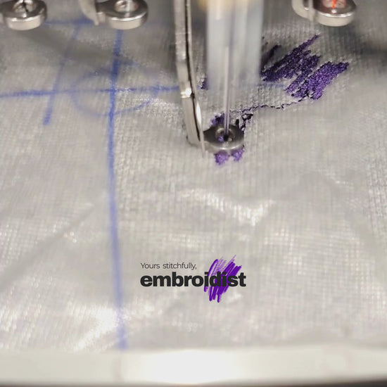 Brother embroidery machine stitching custom logo on fabric at Embroidist Meerut