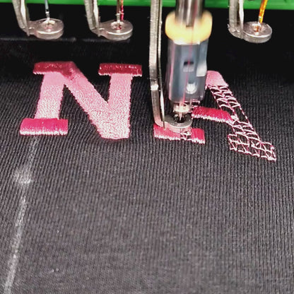 video of making the Custom embroidered oversized t-shirt in pink thread — personalised text tee by Embroidist