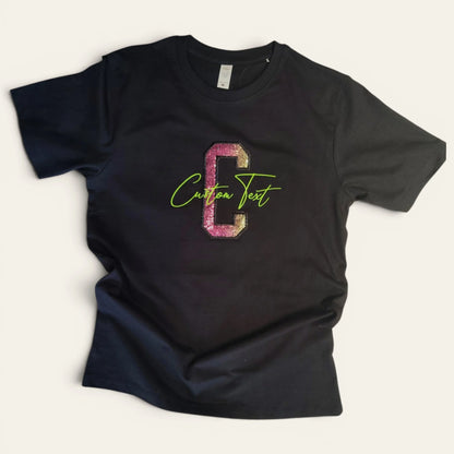 8:17 PMBlack custom sequin appliqué embroidery t-shirt — pink and gold glitter letter C with lime green machine embroidered script, made to order by Embroidist