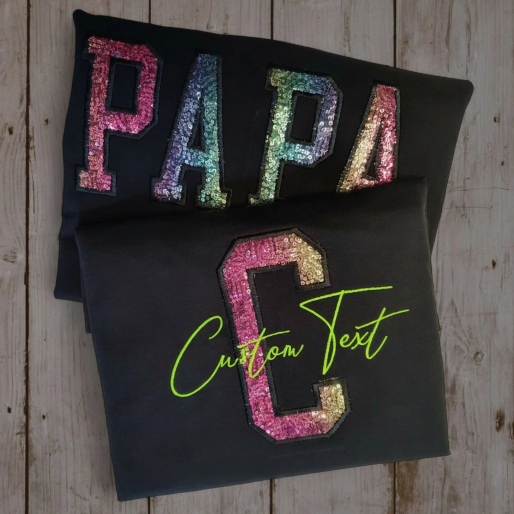 Custom sequin appliqué alphabet tee — PAPA in rainbow sequins and C in pink sequins with lime green script — made to order by Embroidist